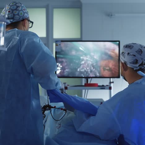 surgeons at work in operating room