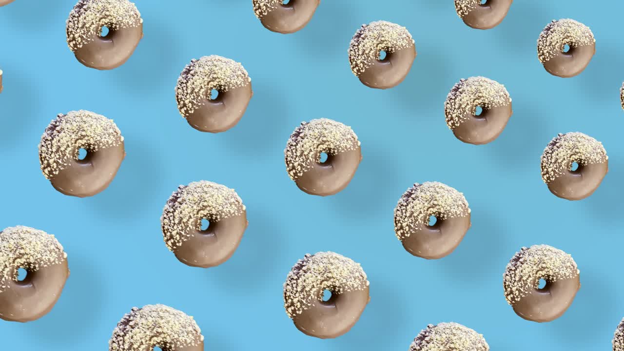 초콜릿 도의 다채로운 패턴은 그림자와 함께 파란색 배경에 고립되어 있습니다. 도, 도,  뷰, 현실적인 애니메이션, 4k 비디오 모션.