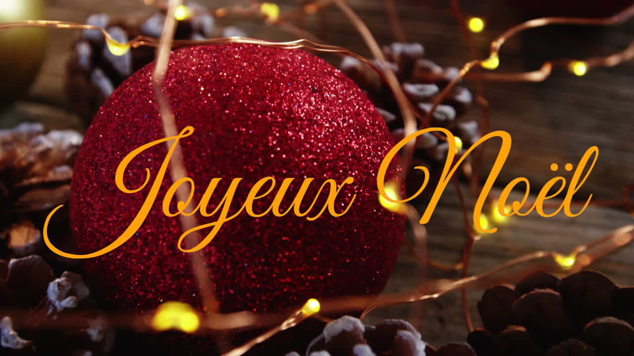 joyeux noël escrito sobre las decoraciones de navidad