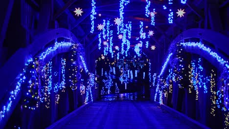 a view of a christmas display of the interior of a covered bridge