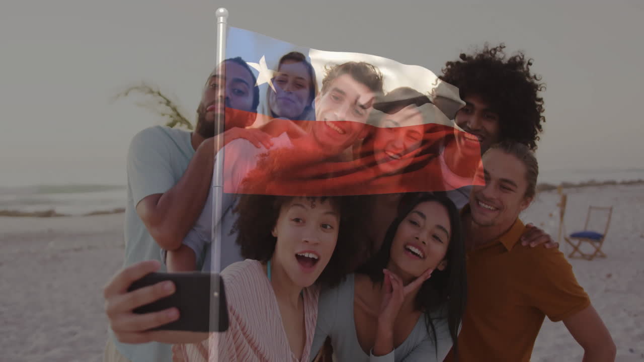 Group of friends taking selfie over Chilean flag animation on beach