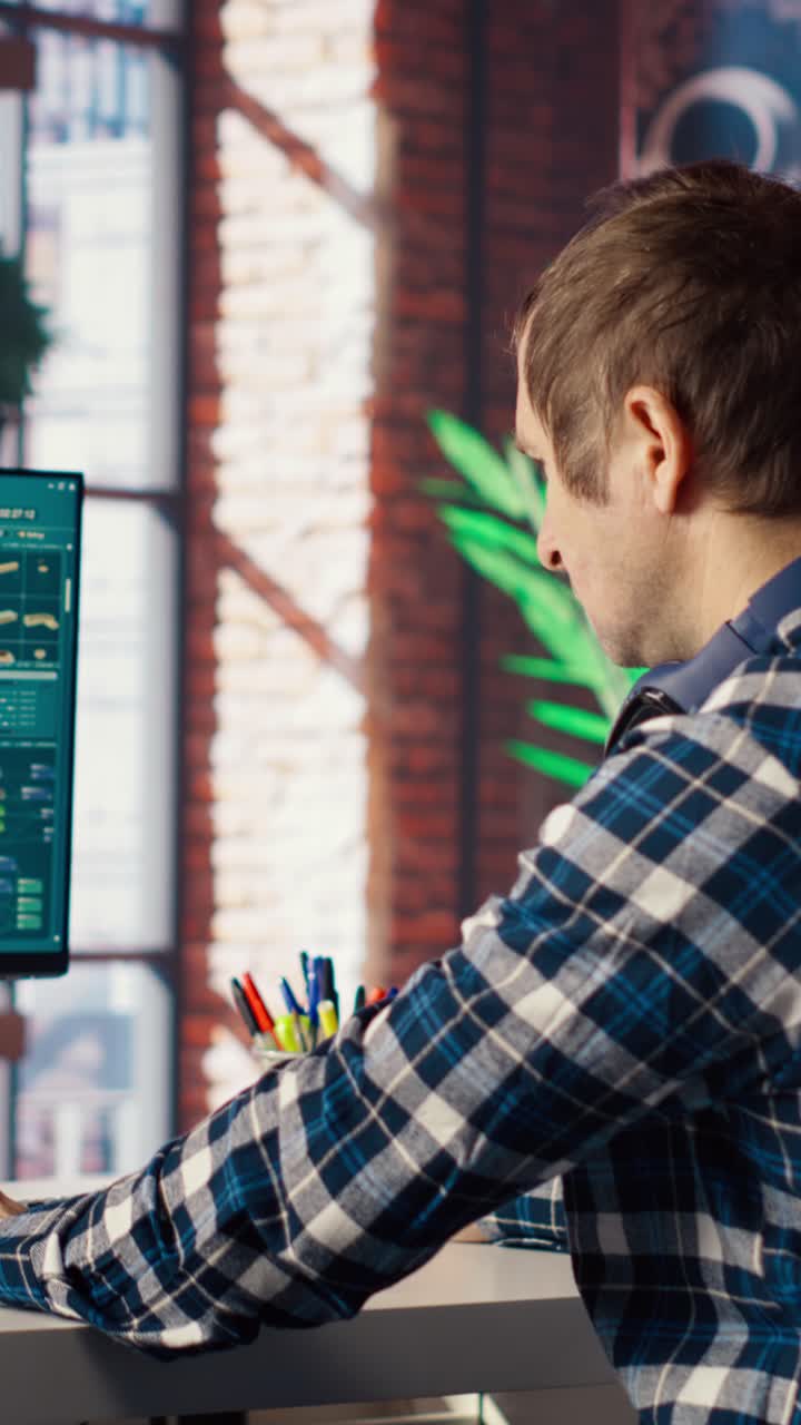 Vertical video Video editor analyzing film montage on chroma key computer