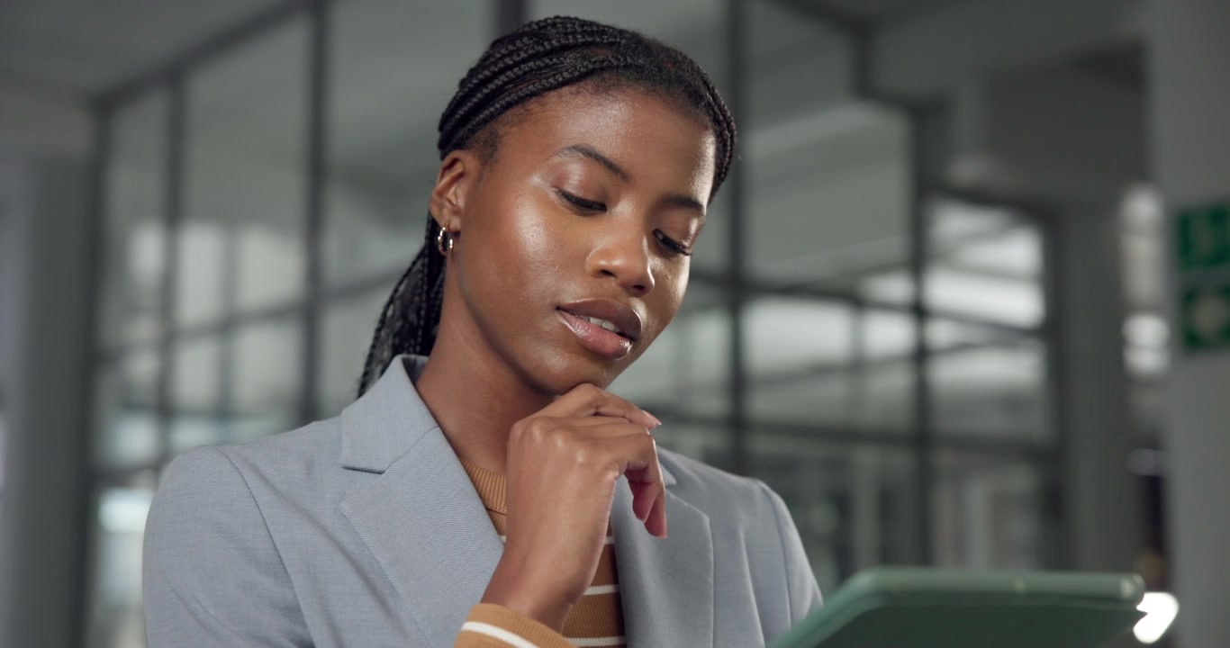 Professional Woman Using Digital Tablet in Modern Office
