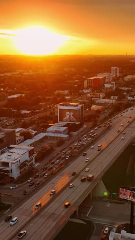 golden hour in the big metropolis. gorgeous view on the scenery of miami, florida, usa with amazing setting sun at backdrop. top view. vertical video
