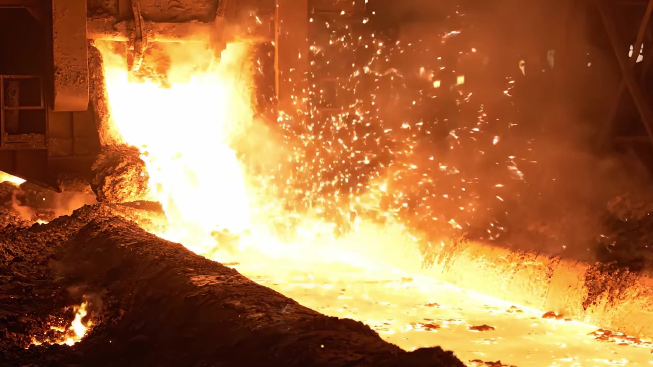 Intense Heat and Illuminating Flames Erupt from the Steel Production Process in an Industrial Setting, Showcasing the Power and Energy of Metalworking