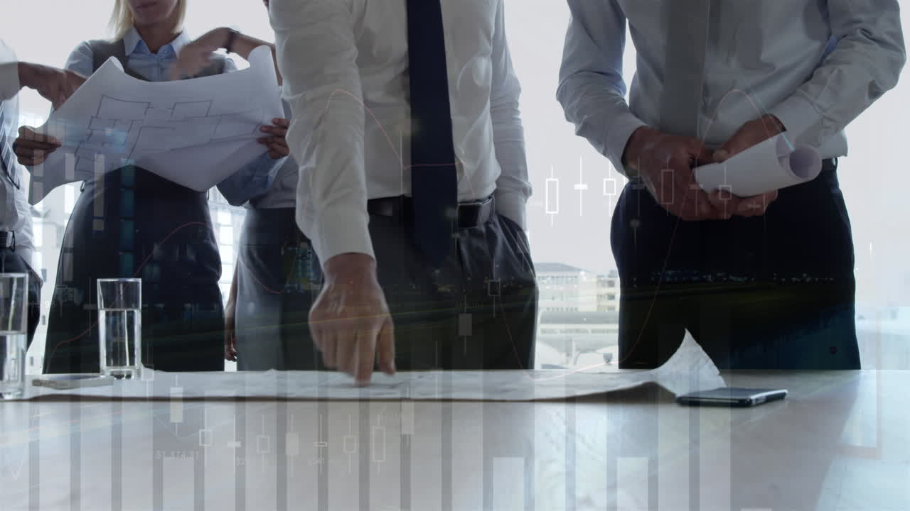 건축가들이 건물 계획 4k에 대해 이야기하고 있습니다.