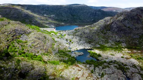 Tera-river-canyon,-dam,-lake,-incredible-shadows-and-light-cast-from-sun-and-clouds,-aerial