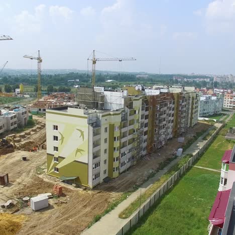 construction of boxes of modern high-rises at the initial stage in the city. aerial view