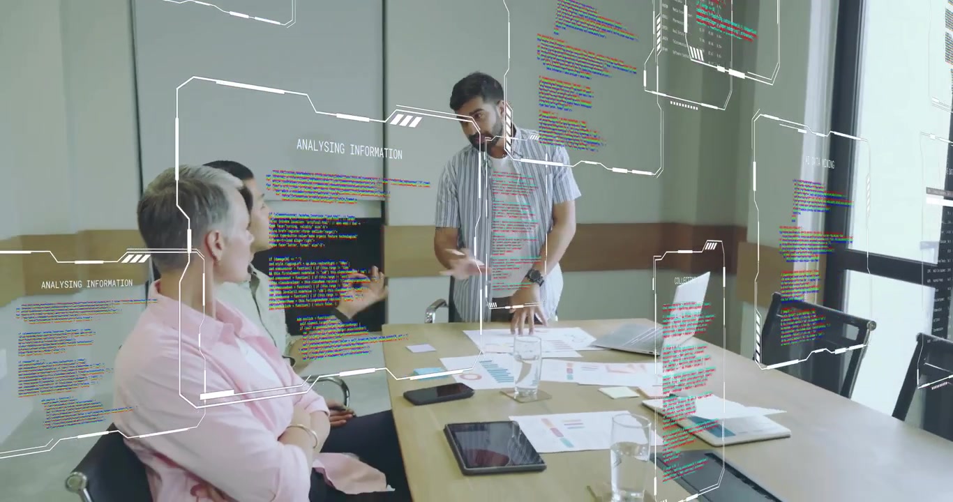 Presenter spreading charts in business meeting, generating animated data overlays on laptop
