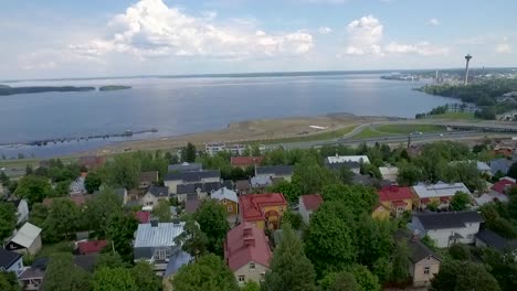 drone shot of historical pispala area dividing two lakes, pyhäjärvi and näsijärvi, in tampere and a look over the city center