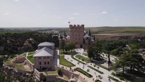 Aerial:-Alcázar-De-Segovia,-With-Plaza-De-La-Reina-Victoria-Eugenia-And-Juan-Ii-Tower