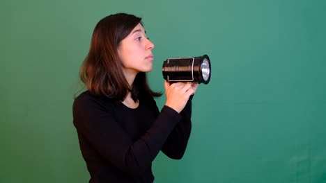 Woman-Flashlight-Green-Background