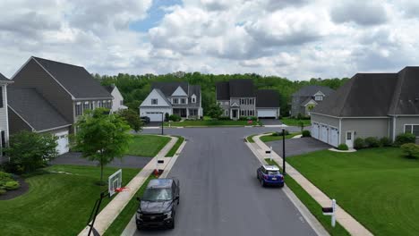 residential street with houses and cars
