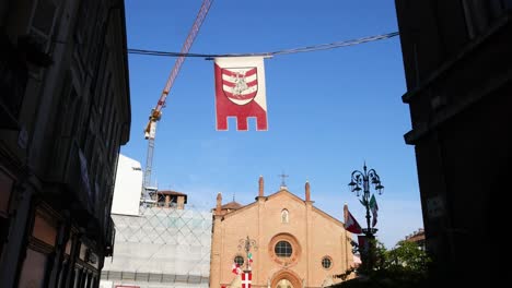 flag being raised in front of church