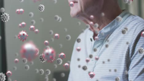 animation of virus cells over senior caucasian man in bed