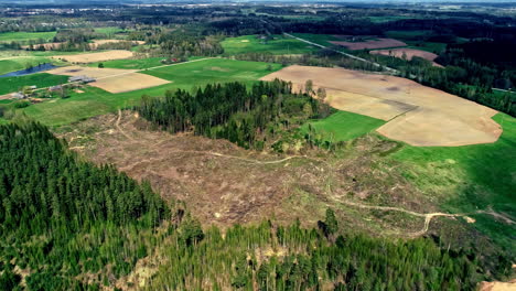 Bird's-eye-view-over-the-beautiful-green-landscape-with-rural-roads-outside-Riga