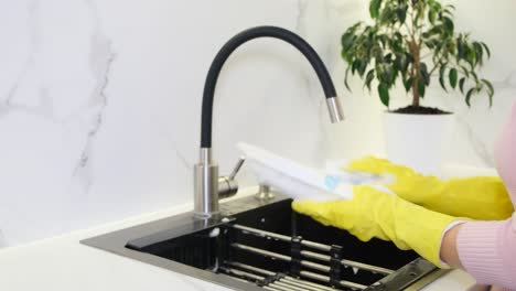 housewife washes the dishes