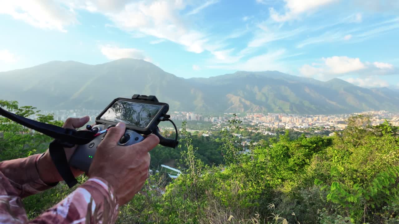 Drone Controller in Foreground with Caracas and El Ávila Mountain View