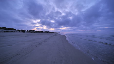 cycling on a beach first person view between carnon and la grande motte sunrise