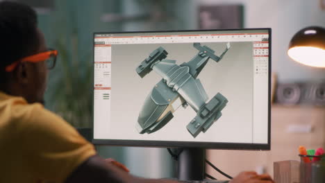 person designing aircraft model on computer