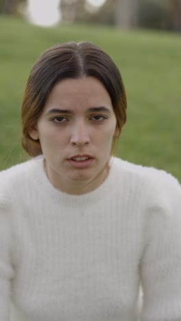close-up portrait of a young woman outdoors
