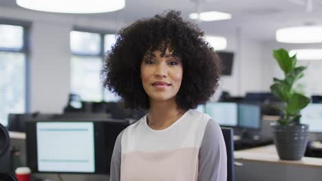 Portrait-of-happy-african-american-businesswoman-in-office,-slow-motion