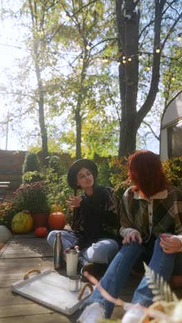 two friends enjoying a cozy autumn day