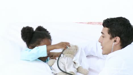 young doctor talking with a little girl
