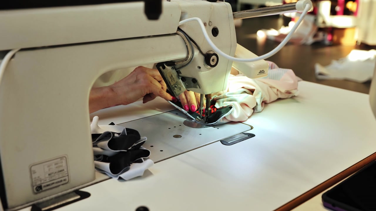 Close view of textile assembly highlighting craftsmanship and factory workflow