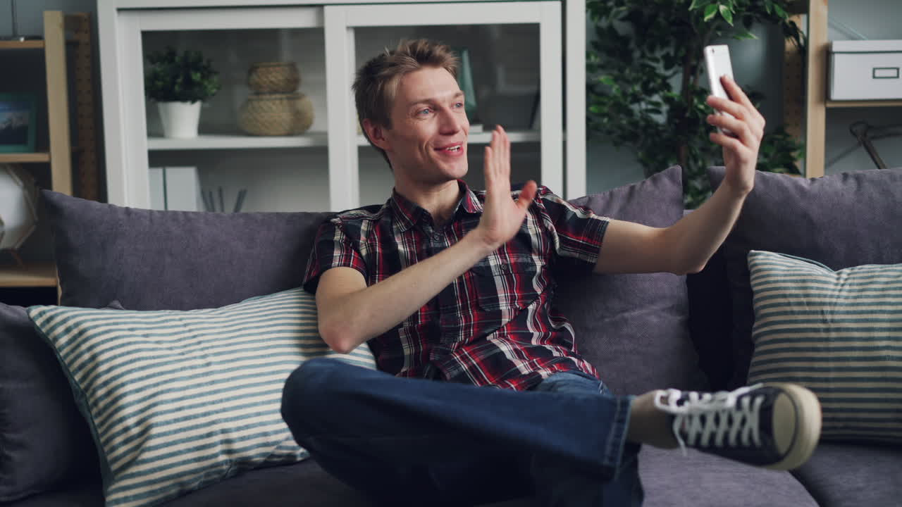Man Taking a Selfie on the Couch