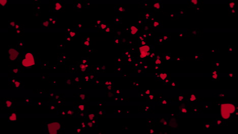 corazones rojos flotando sobre un fondo negro