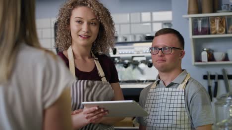 Caucasian-man-with-down-syndrome-learning-how-to-take-orders.