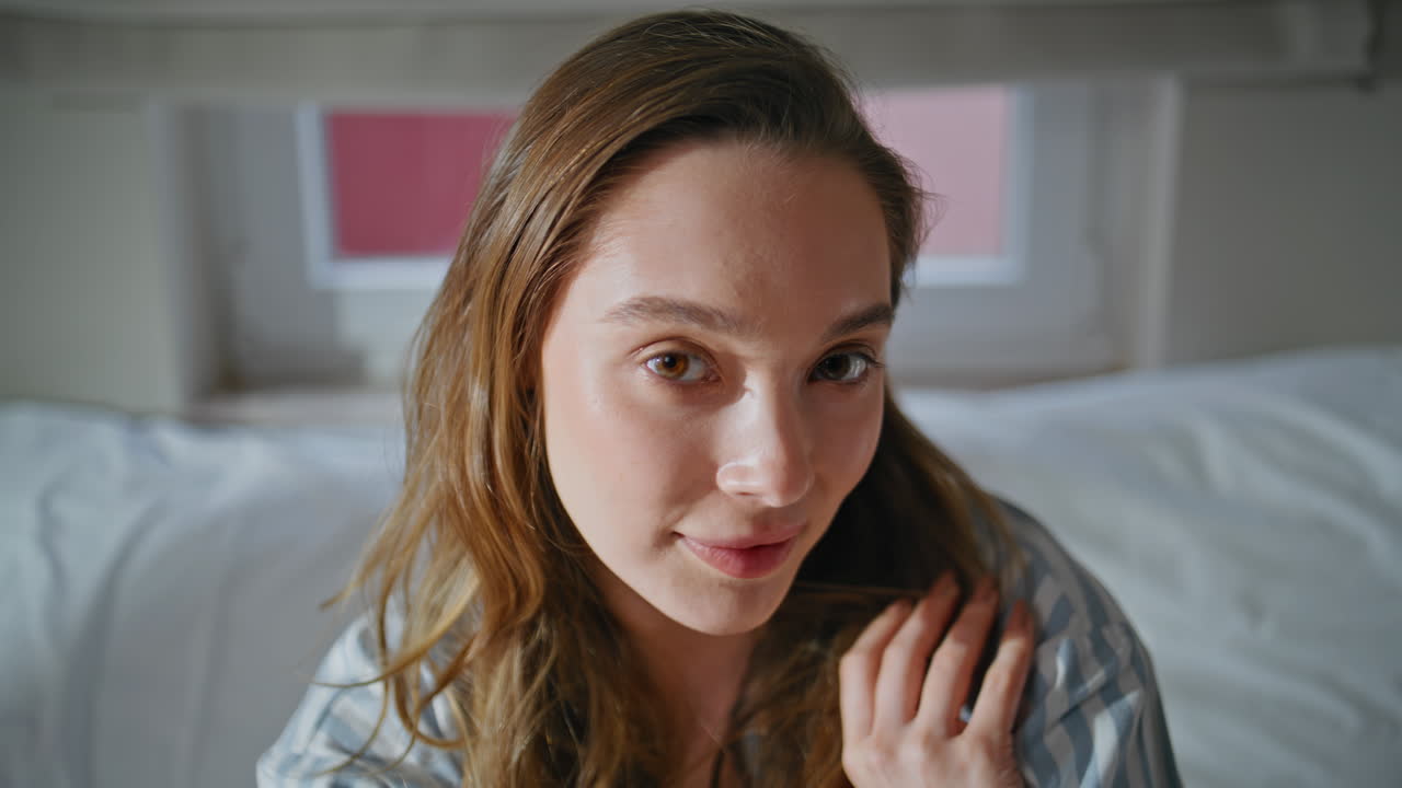 Dreamy woman enjoy morning tranquility in bedroom closeup. Portrait gentle girl