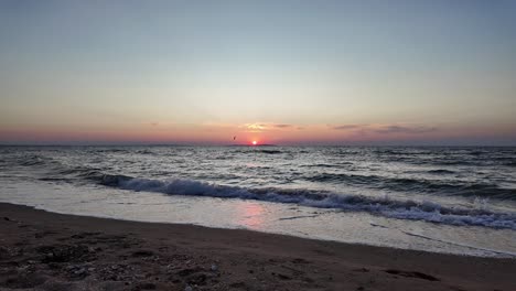 witness the stunning sunset casting vibrant colors over the tranquil waters of the sea of azov in crimea during this serene moment