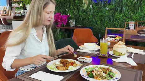 woman eating at a restaurant buffet