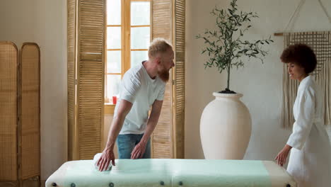 mam preparing the room for the massage