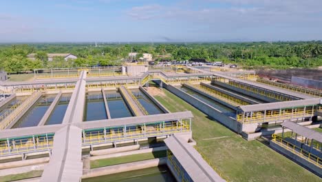 drone flight over treatment plant in tropical area on dominican republic island at sunny day