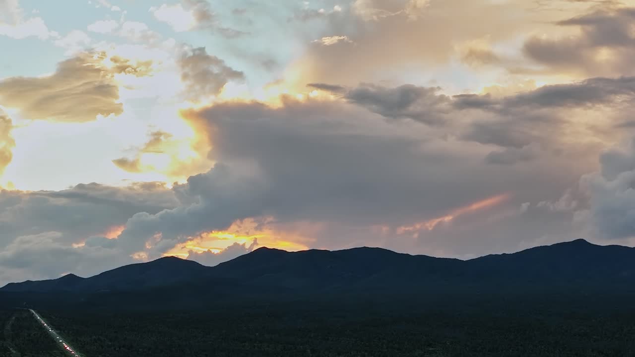 Aerial view of sunset over mountains and road in the USA