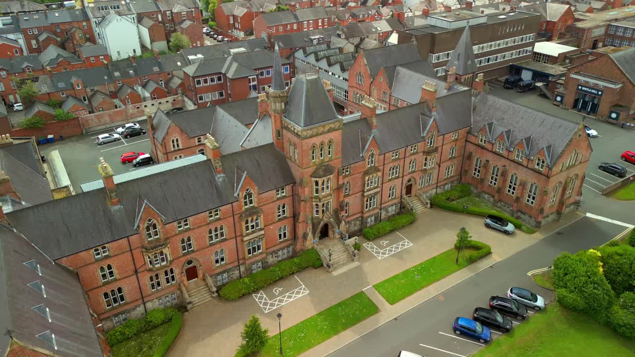 Ascending aerial video of Methodist College Belfast, in Northern Ireland, UK on a bright and sunny day. Filmed in 4K, 60FPS and with Rec709 color.
