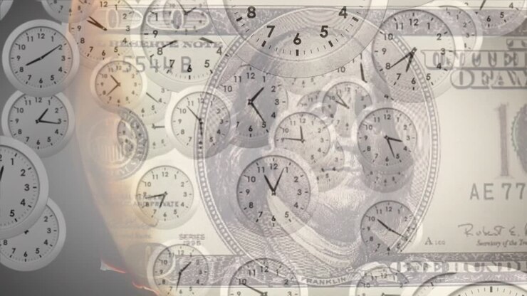 Animation of clocks moving over banknotes