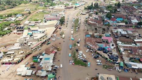 aerial drone view open air market in the loitokitok town, kenya and mount kilimanjaro- rural village of kenya