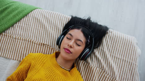 woman relaxing with headphones