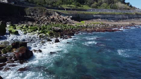 Turquoise-Cantabrian-Sea-water-breaks-on-rocky-north-Spain-shoreline