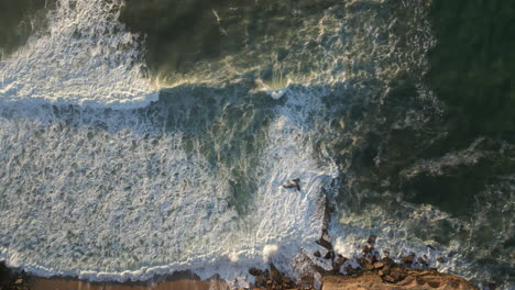 Panning-shot-of-waves-breaking-at-Ericeira-in-Portugal