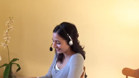 jolly woman talking on internet with headset on