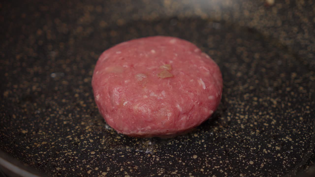 Pan Frying Homemade Beef Patty. Close-up Shot