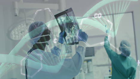 animation of dna strand and chemical formula over diverse surgeons working at hospital