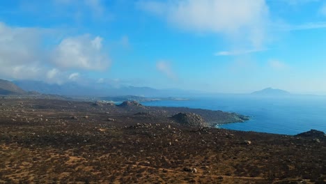 Aerial-ascending-shot-with-a-view-of-the-cliffs-and-the-sea