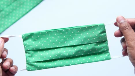 green dotted fabric face mask