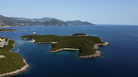 aerial revealing shot of mourtemeno island in syvota, greece